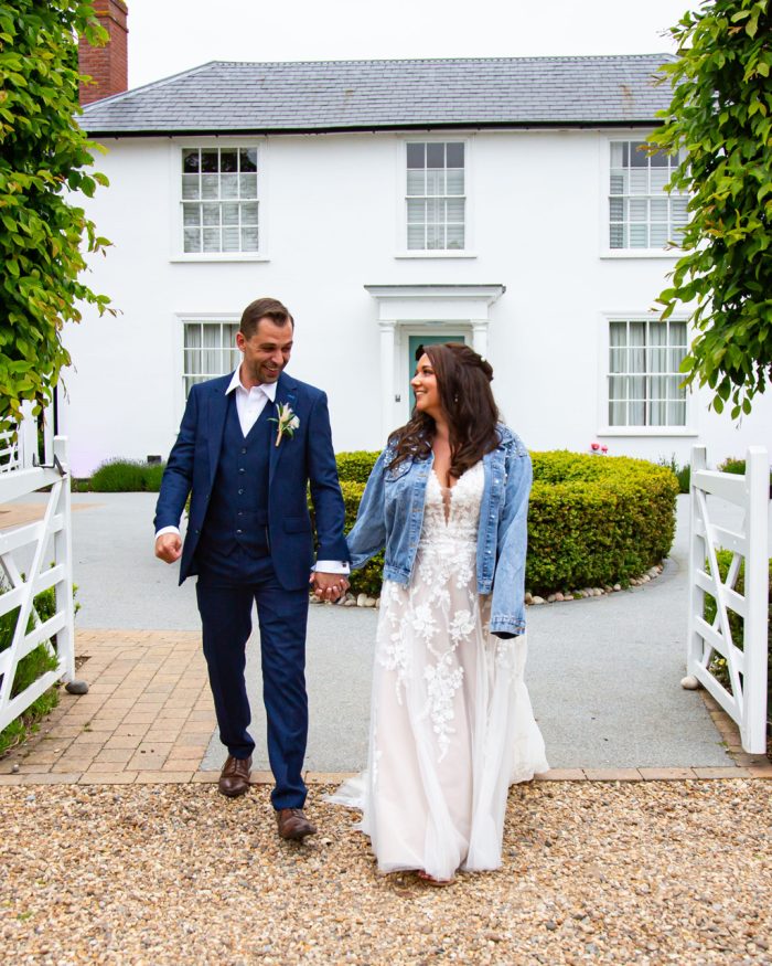 Bride and groom walking hand in hand